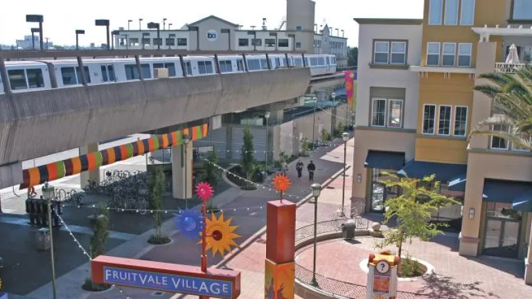 train running above Fruitvale Village