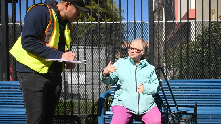 A transit passenger participates in an MTC survey.