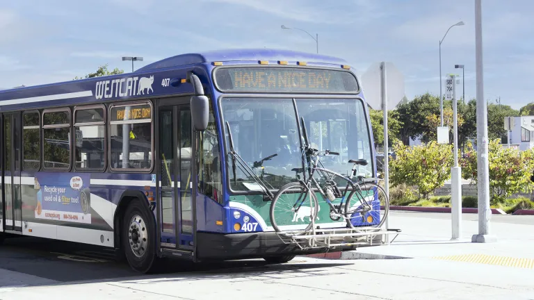 A WestCAT bus with a bicycle on the front rack at El Cerrito del Norte BART station.