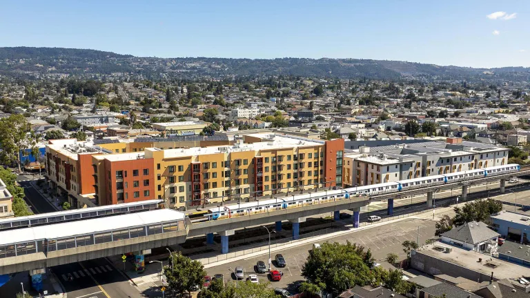 Aerial over apartment buildings at Fruitvale BART Station.