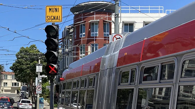 A "Muni signal" sign at an intersection in San Francisco.