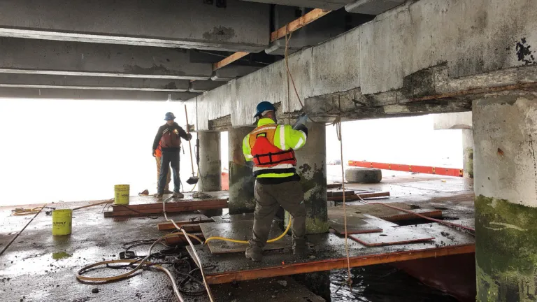 Workers making maintenance repairs on the San Mateo-Hayward Bridge.