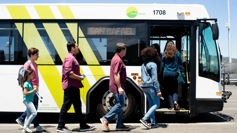 Passengers boarding a Marin Transit bus.