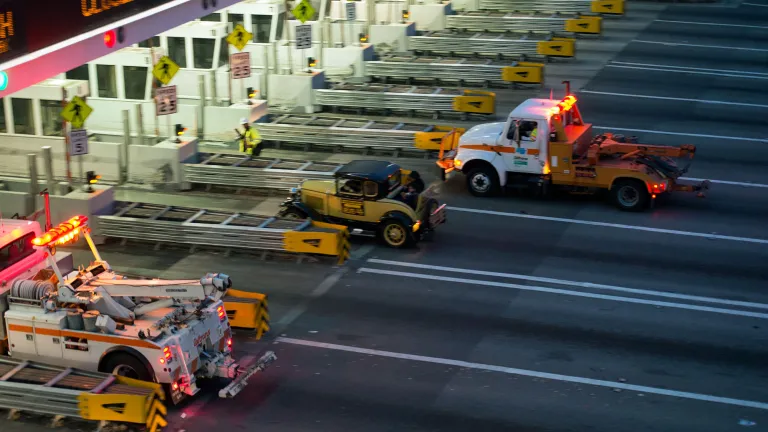 A driver piloting a yellow Model T Ford had the honor of being the last car to drive through the Bay Bridge toll plaza before the permanent closure of the old East Span.