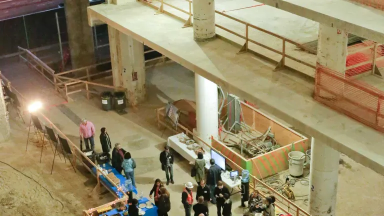 Neighbors mingle in the construction zone at 375 Beale Street in San Francisco — the old US Postal Service building that will soon serve as the regional agency headquarters — at an open house in February.