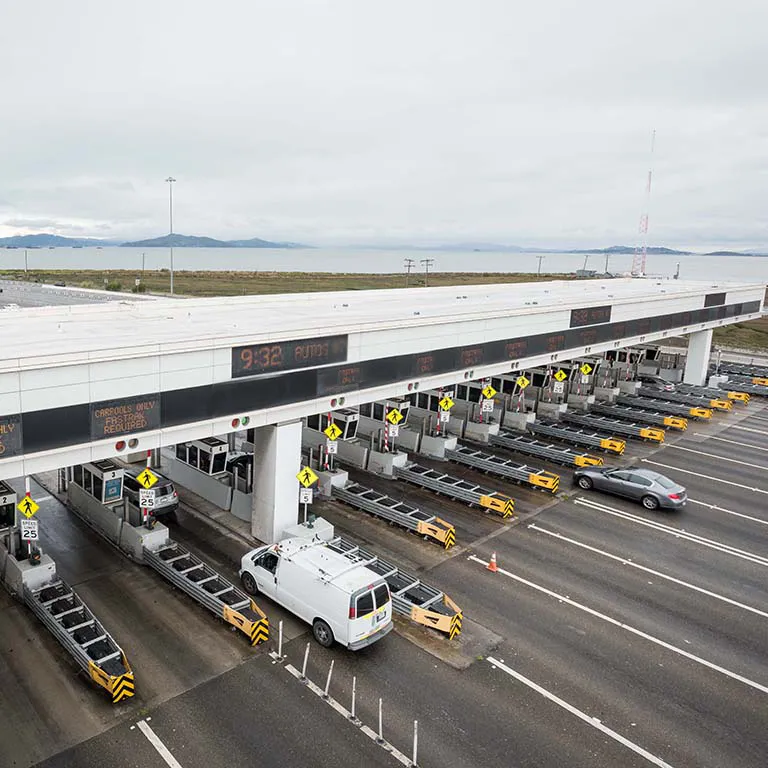 Aerial over the San Francisco-Oakland Bay Bridge Toll Plaza.