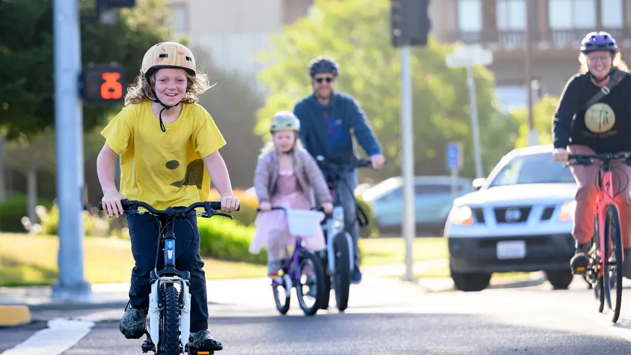 Happy adults and children on Bike to Wherever Days 2025.