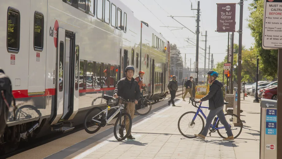 Cyclists exiting a Caltrain train on Bike to Wherever Day 2025.