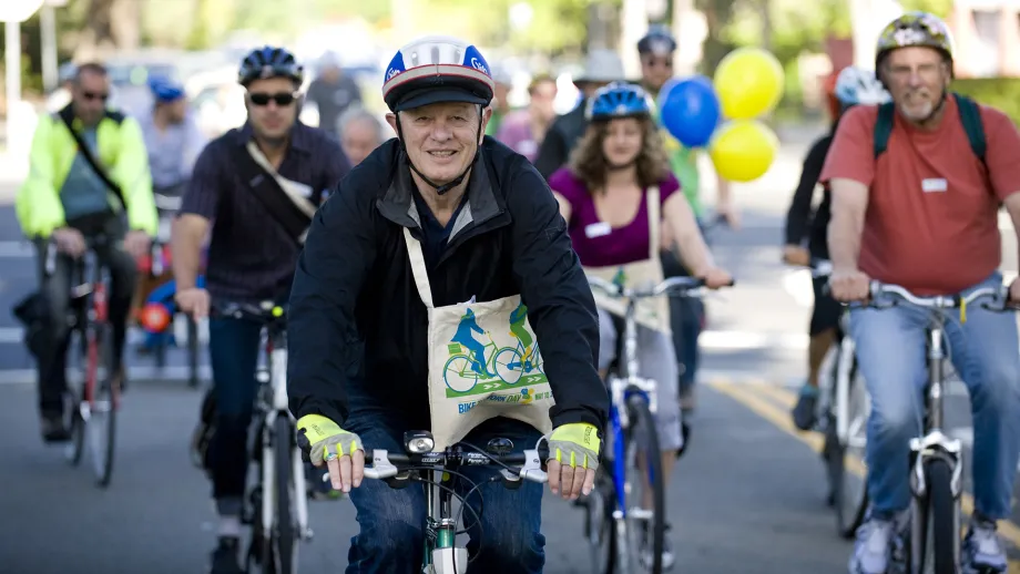 Then-Berkeley Mayor Tom Bates rides with a crowd in 2012.
