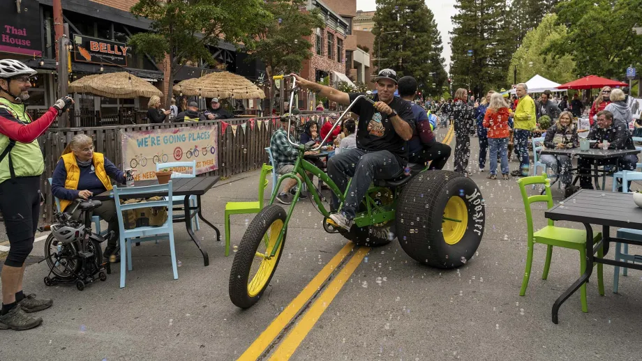 A big-wheel bicycle blowing bubbles at the Santa Rosa Block Party on Bike to Work Day.