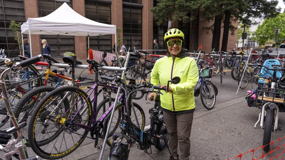 A volunteer parking bicyles at the Santa Rosa Block Party on Bike to Work Day.