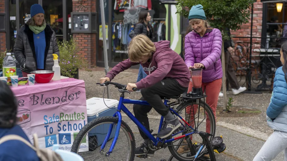 A cyclist on a pedal-powered smoothie machine at the Santa Rosa Block Party on Bike to Work Day.