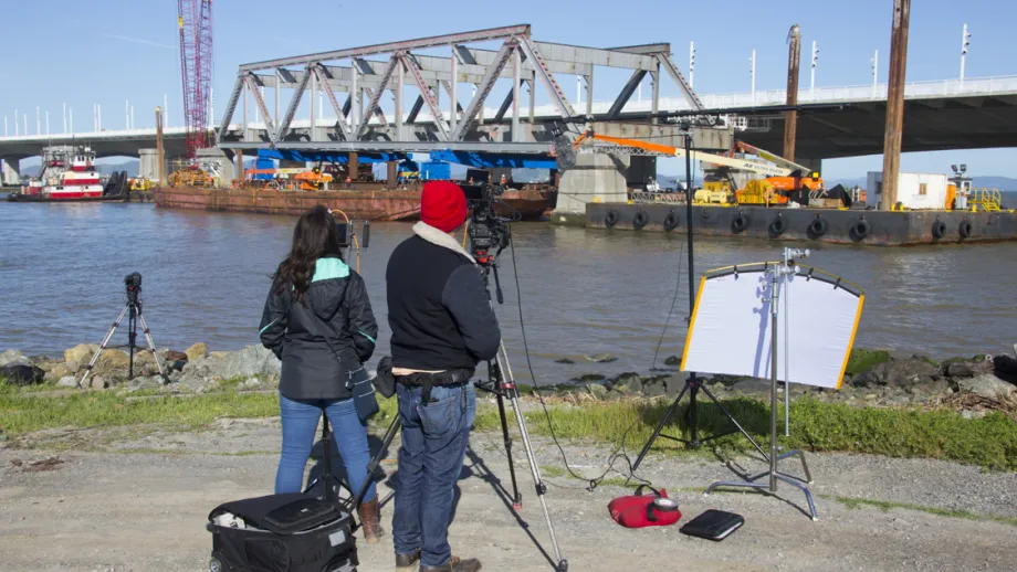 camera crew filming Truss being moved on a barge