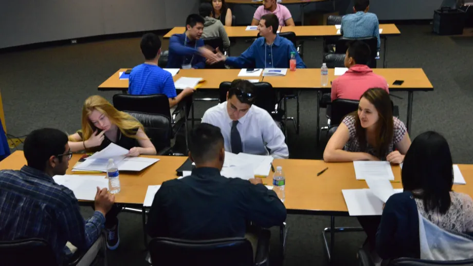 people sitting at a table talking