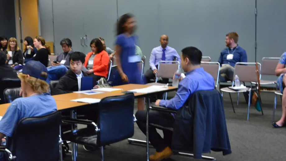 people sitting in tables and chairs