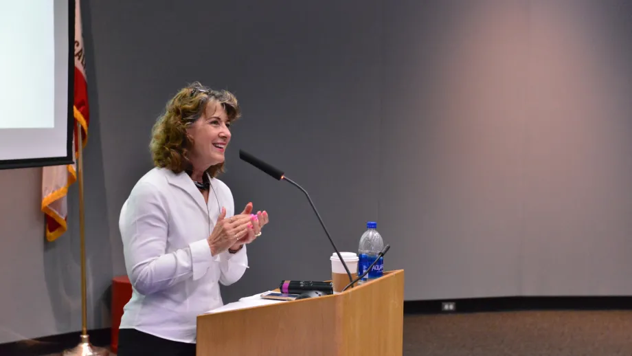 woman at podium speaking