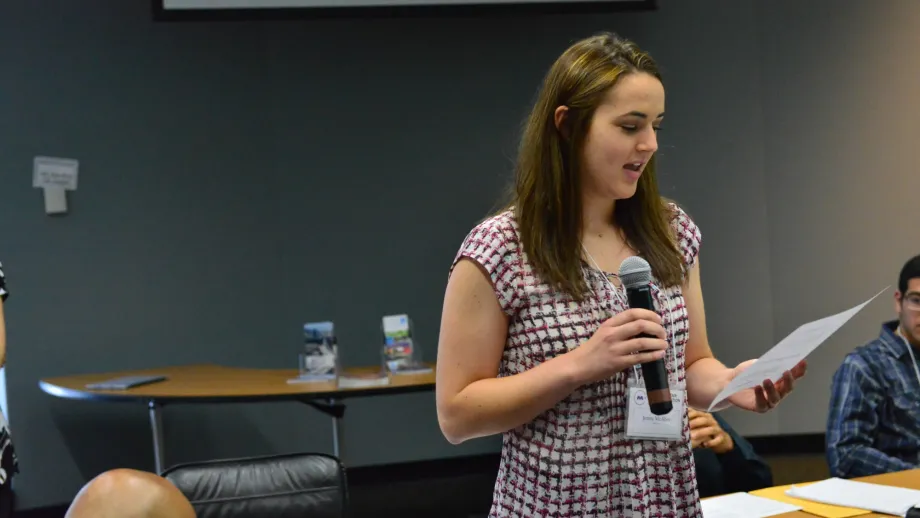 woman talking into a microphone