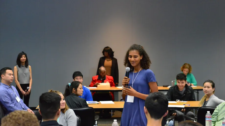 woman talking into a microphone