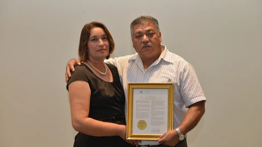Freeway Service Patrol tow truck driver Moises Reyes with his wife