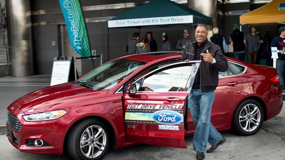 man getting in electric car