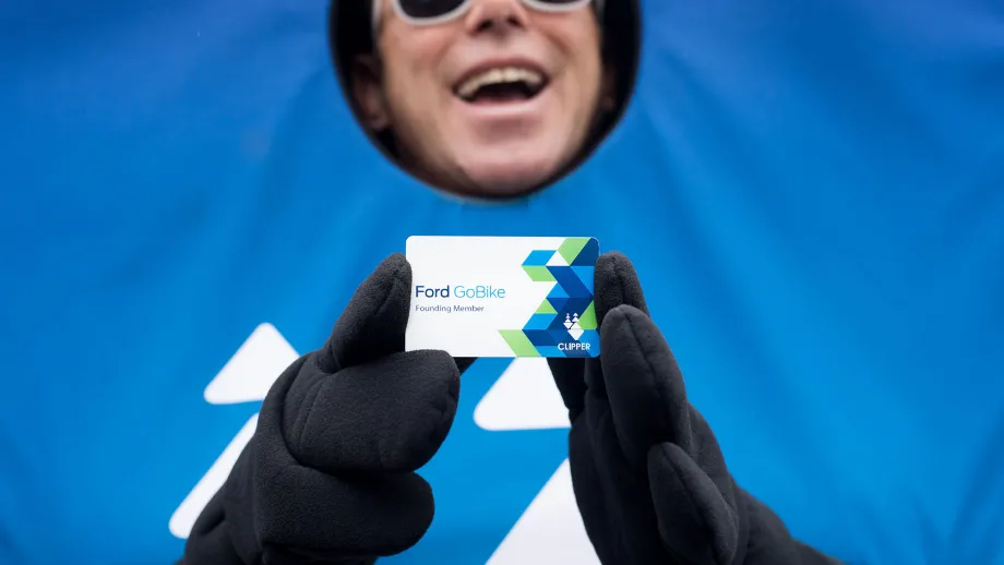 man dressed in clipper card costume holding a clipper card