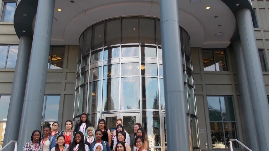 Student participants in Transportation YOU pose for a group photo in front of the Department of Transportation in Washington, D.C.