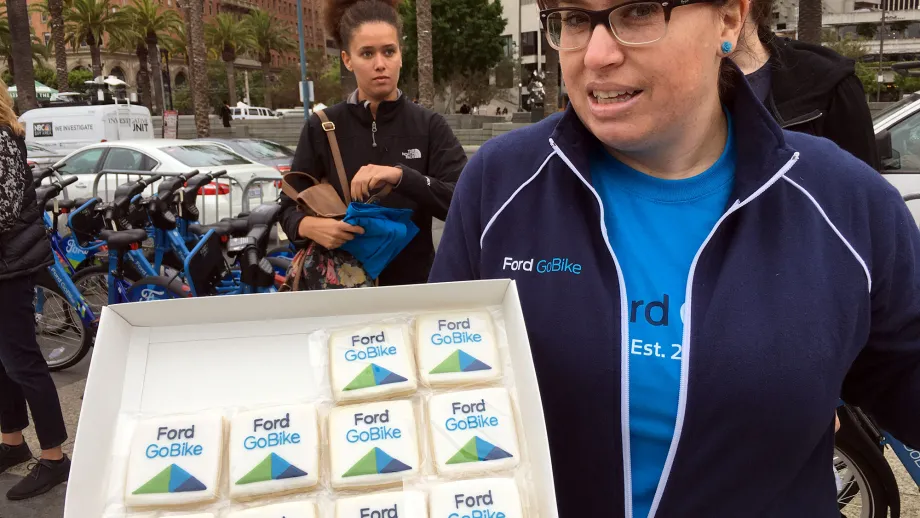 woman holding a box of clipper cards