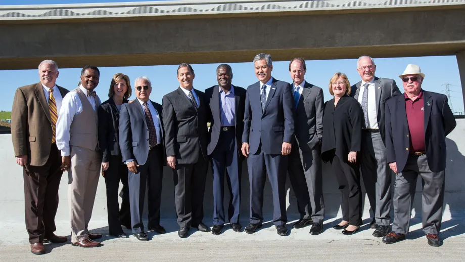 group of people posing for picture in front of Highway 4
