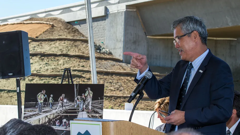 Man at podium talking to a crowd