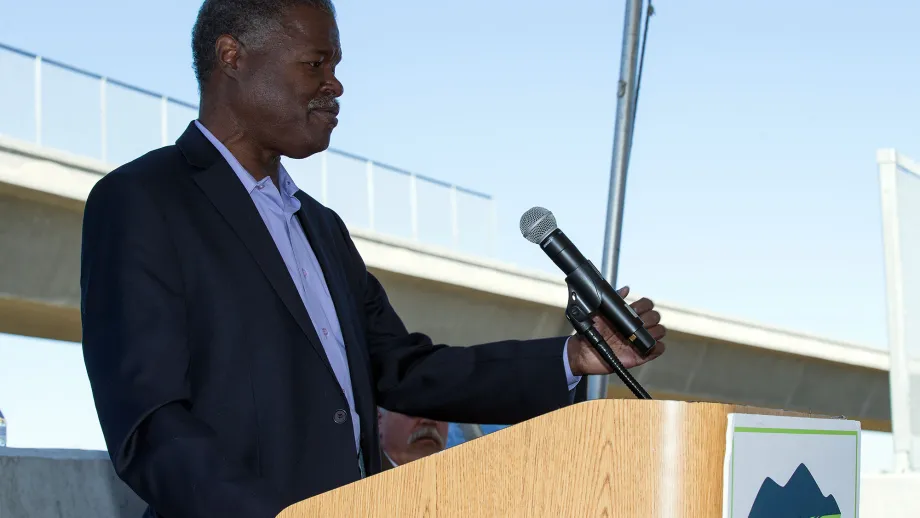 Man at podium talking to a crowd