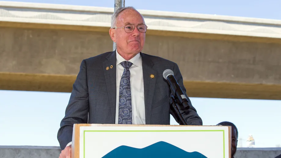 Man at podium talking to a crowd