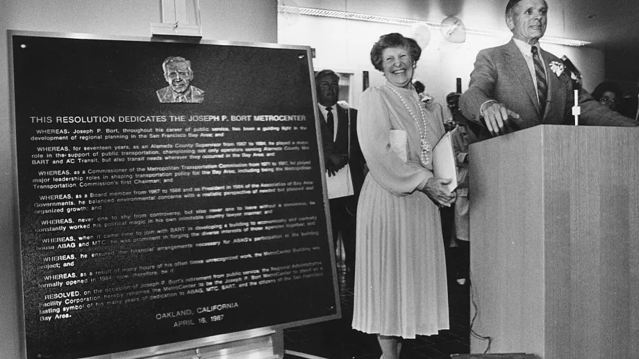 With his wife Jackie at his side, Joseph P. Bort speaks to the crowd at the April 1987 unveiling of the plaque dedicating the MetroCenter in his name.