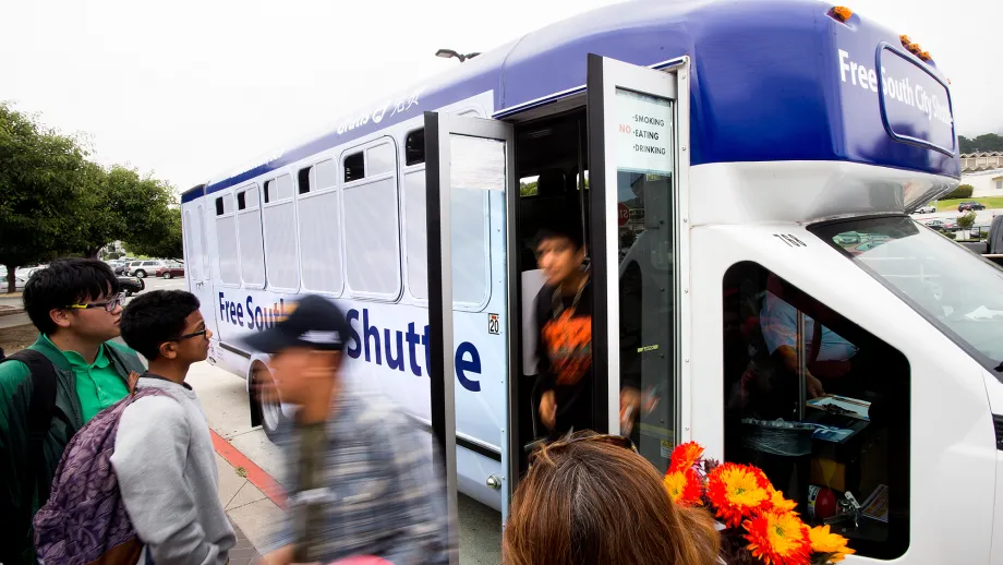 Young people exit the free South San Francisco community shuttle.