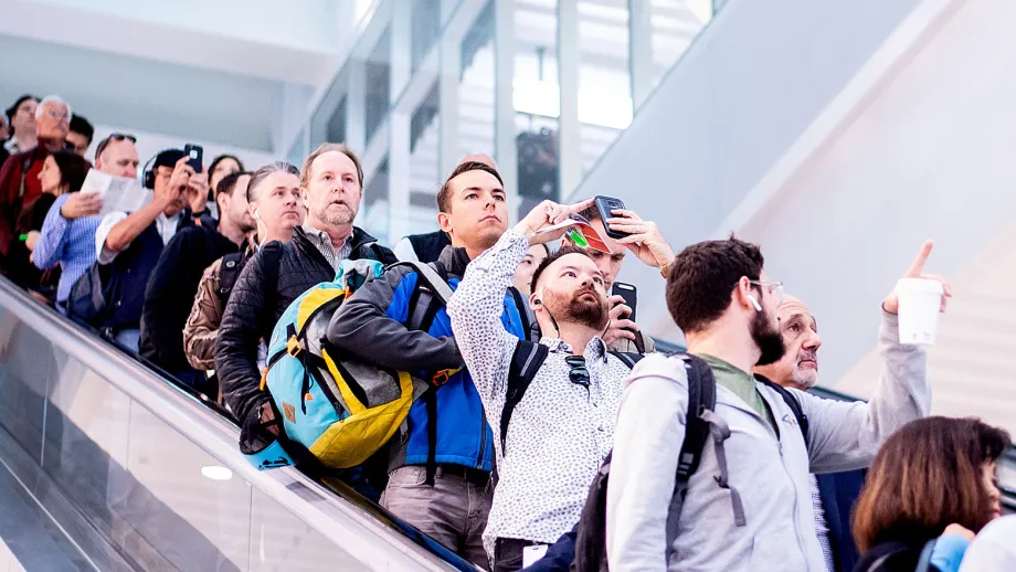Commuters photograph the Oculus as they disembark at the Salesforce Transit Center during the first day of AC Transit service
