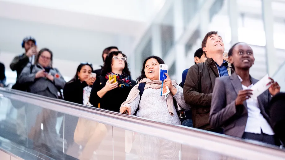 Commuters disembark at the Salesforce Transit Center during the first day of AC Transit service
