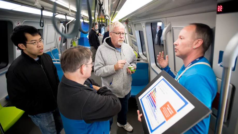 men talking on train