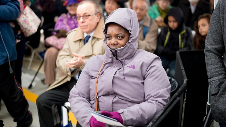 woman sitting in chair with winter coat on