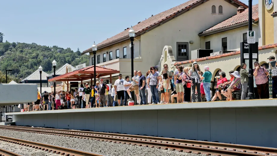 group of people waiting at SMART train station