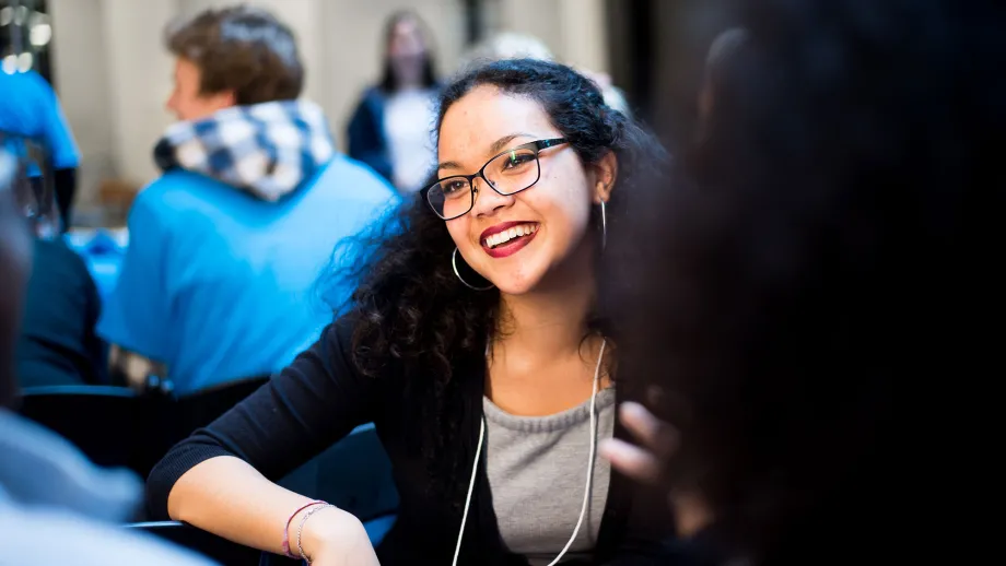woman with glasses smiling