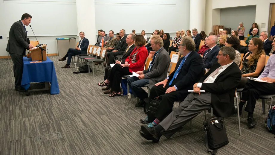 Assembly Speaker pro Tem Kevin Mullin accepts the John F. Foran Legislative Award as the audience looks on.