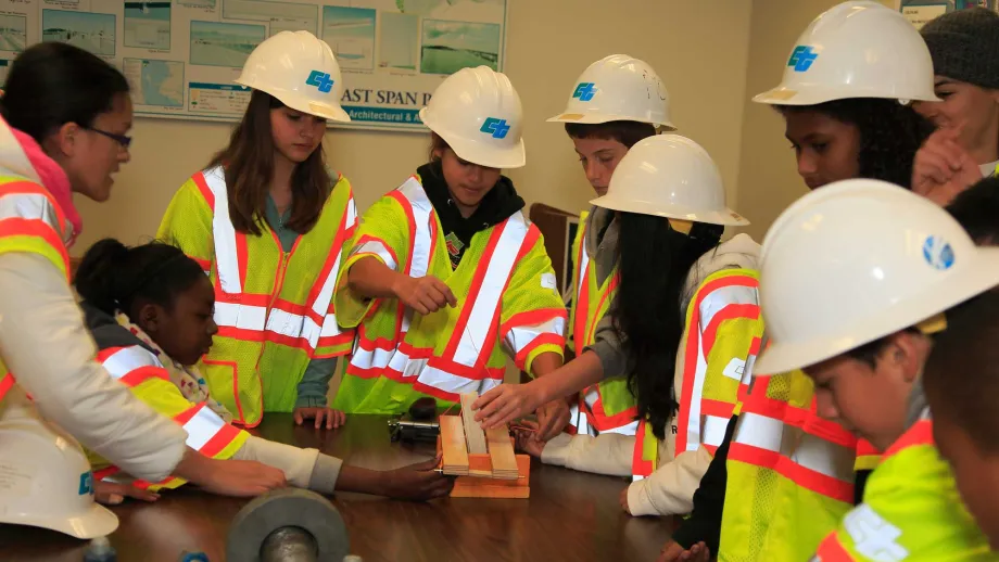 The students complete a model bridge-building group challenge in just a few minutes. 