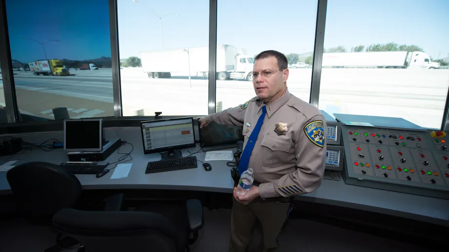 CHP Commander Mike Ferrell gives a tour of the operations building, where officers review data coming in from sensors outside.