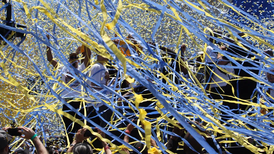 A cloud of confetti and streamers engulf the stage, a physical representation of the joy in the players', owners', officials' and fans' hears. 