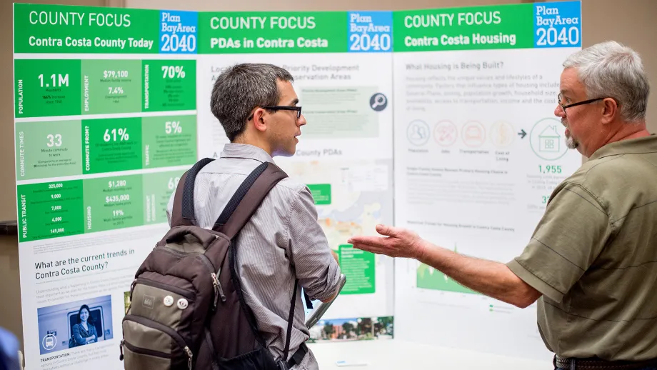A member of the public examines a display