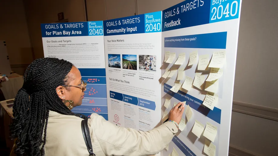 A member of the public examines a display