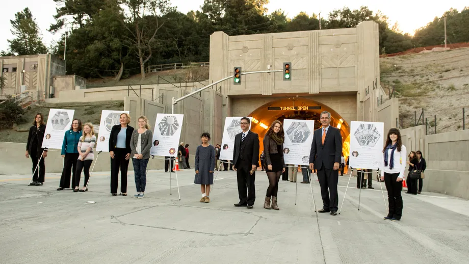 The medallion artists pose with their designs. 
