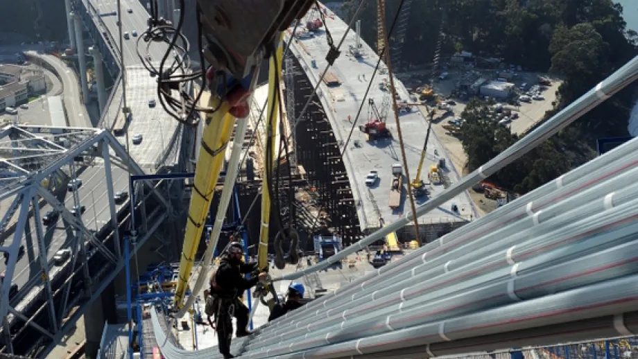 Ironworker Casey Lux on the maincable of the new East Span. 