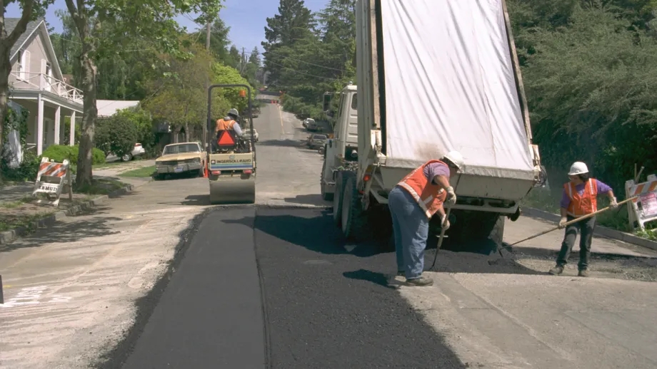Road crews performing street maintenance