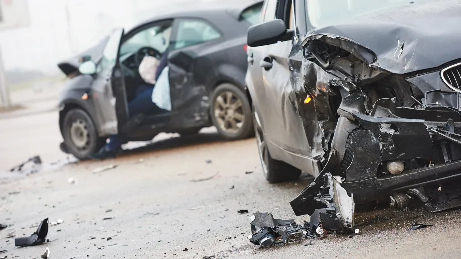 Two cars that have been damaged in a collision.