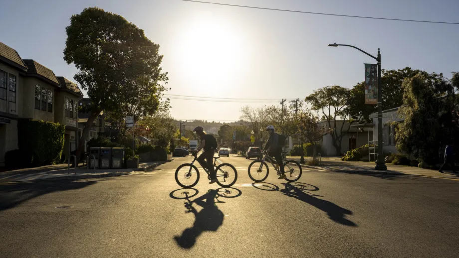 Silhouette of two cyclists in Albany.